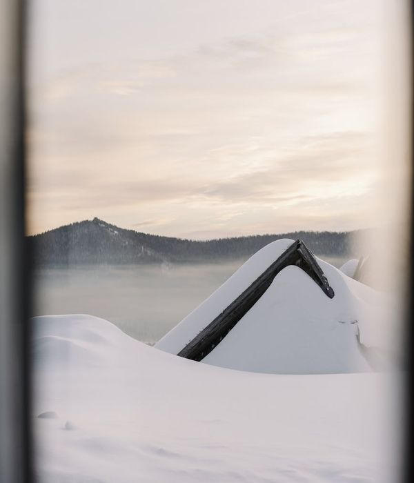 A person feeling energized and stretching outdoors at sunrise.